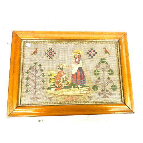 2 - Vintage framed needle work named ADI depicting a lady giving a dog a treat measures approx 18inches ... 