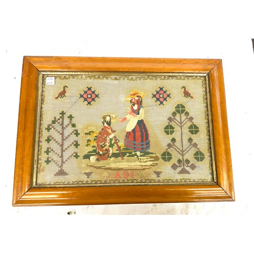 2 - Vintage framed needle work named ADI depicting a lady giving a dog a treat measures approx 18inches ... 