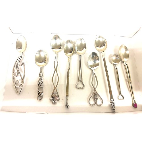 518 - Selection of 9 novelty Silver spoons