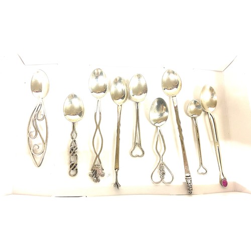 518 - Selection of 9 novelty Silver spoons