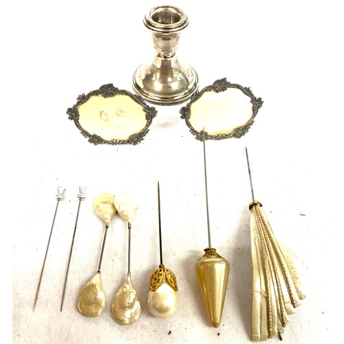 443 - Selection of vintage ladies hat pins, a silver candle stick and 2 miniature photo frames