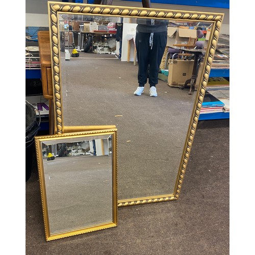 229 - 2 Gilt framed mirrors largest measures approx 38 inches tall 27 inches wide