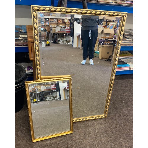 229 - 2 Gilt framed mirrors largest measures approx 38 inches tall 27 inches wide