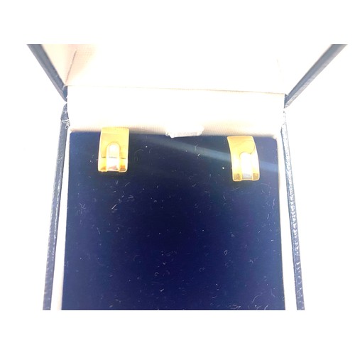 496 - Pair of ladies boxed 18ct gold Lumbers earrings, total weight 1.6grams