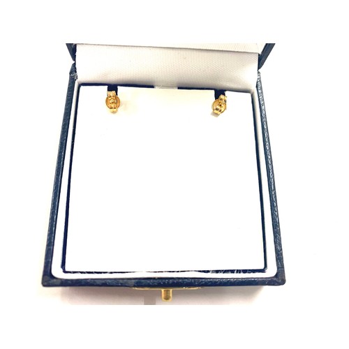 496 - Pair of ladies boxed 18ct gold Lumbers earrings, total weight 1.6grams