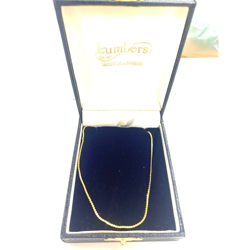 495 - Ladies boxed Lumbers 9ct Gold chain, hallmarked, total weight approx 2 grams