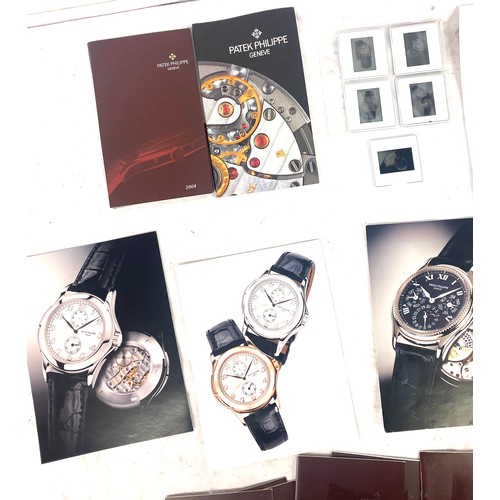 447 - Patek Philippe Box with a selection of Patek Philippe photgraphs, books etc