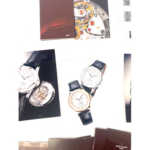 447 - Patek Philippe Box with a selection of Patek Philippe photgraphs, books etc