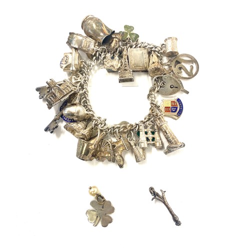 502 - Vintage silver charm bracelet with charms, approximate total weight 96.8 grams