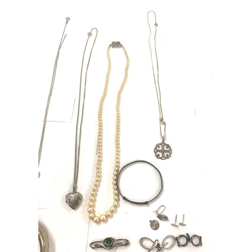 501 - Large selection vintage silver jewellery to include lockets, chains, pendants, cuff bangle, brooches... 