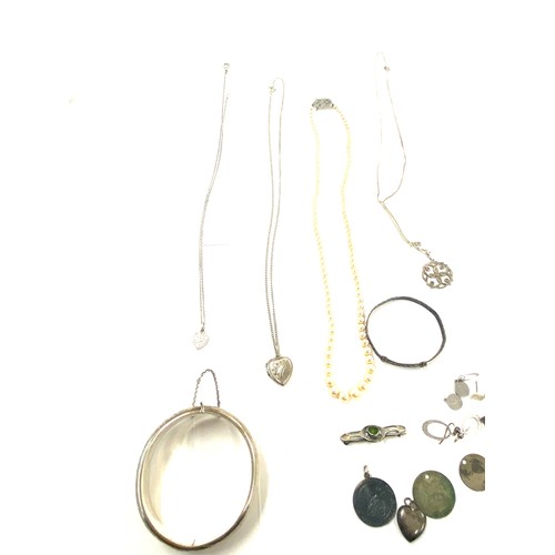 501 - Large selection vintage silver jewellery to include lockets, chains, pendants, cuff bangle, brooches... 