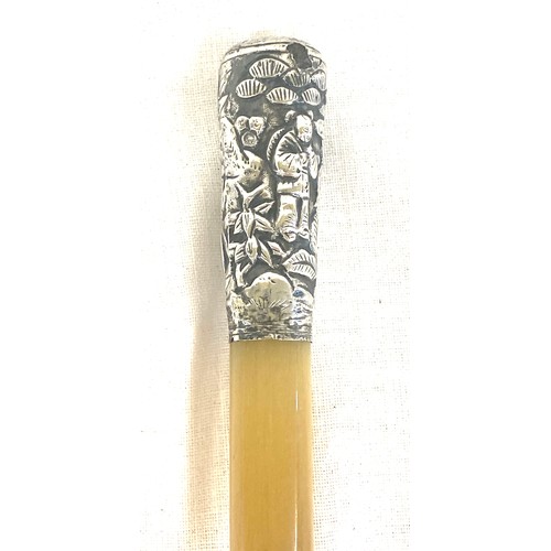 463A - A Rhinoceros Rhino horn swagger stick cane. the top mount of unmarked silver with Chinese decoration... 