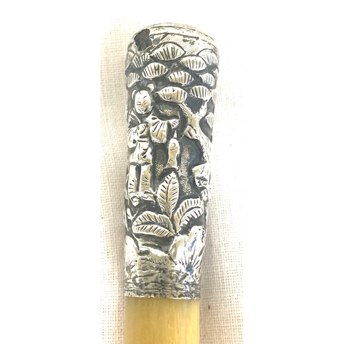 463A - A Rhinoceros Rhino horn swagger stick cane. the top mount of unmarked silver with Chinese decoration... 