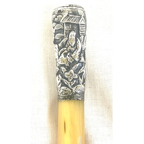 463A - A Rhinoceros Rhino horn swagger stick cane. the top mount of unmarked silver with Chinese decoration... 