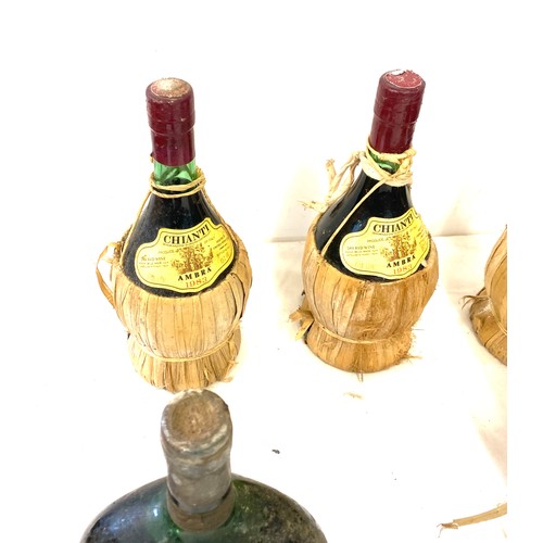 174 - Selection of vintage bottles of wine includes Chianti, melini  etc