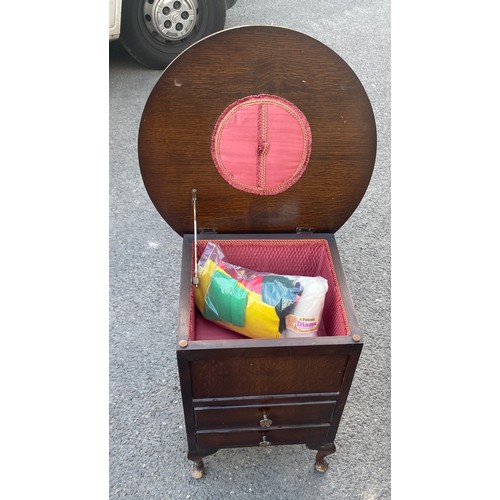 591 - Queen Oak sewing table and contents measures approx 21 inches tall 20 inches diameter