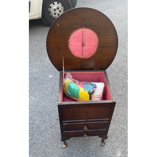 591 - Queen Oak sewing table and contents measures approx 21 inches tall 20 inches diameter