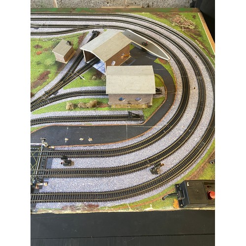 577 - Table top model train layout with buildings and accessories, this measures approximately Length 72 i... 