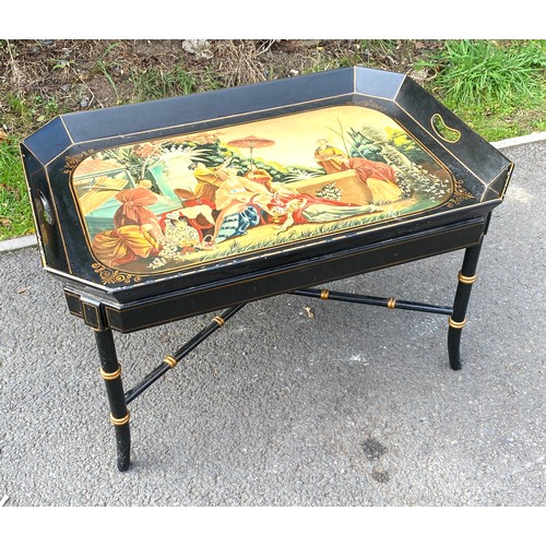 587 - Hand painted black and gilt coffee table, with feature top, approximate measurements: Height 18.5 in... 