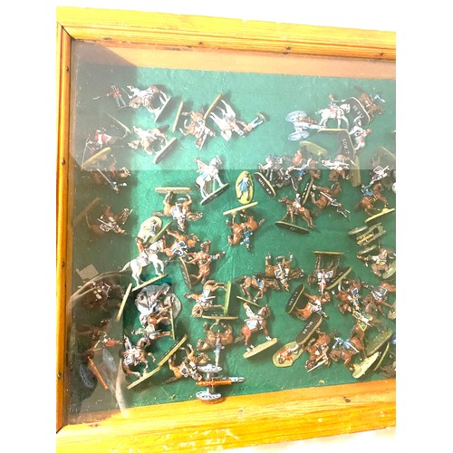 280 - Large selection of lead soldiers in showcase, showcase measures 28