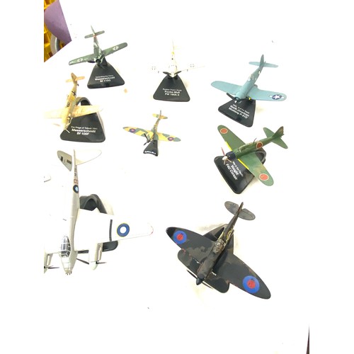 108 - Selection of metal aircraft models on stand includes spitfire night fighter, north american mustang ... 