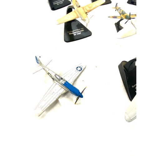 108 - Selection of metal aircraft models on stand includes spitfire night fighter, north american mustang ... 