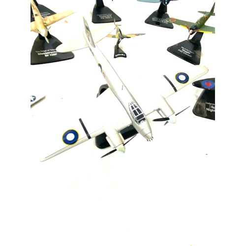 108 - Selection of metal aircraft models on stand includes spitfire night fighter, north american mustang ... 