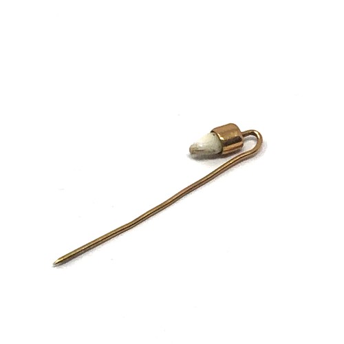 93 - Antique gold tooth set  stick pin measures approx 4.3cm long