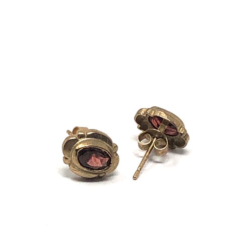 94 - 9ct gold garnet earrings weight 1.7g