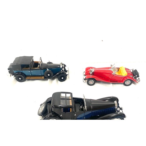 80 - Three model cars includes the franklin mint 1929 rolls royce,  1930 Bugatti Royalle, Mercedes Benz 5... 