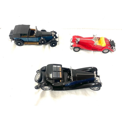 80 - Three model cars includes the franklin mint 1929 rolls royce,  1930 Bugatti Royalle, Mercedes Benz 5... 