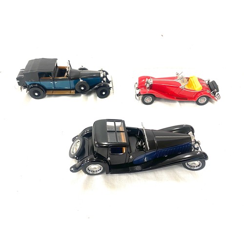 80 - Three model cars includes the franklin mint 1929 rolls royce,  1930 Bugatti Royalle, Mercedes Benz 5... 