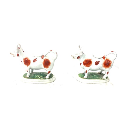 111 - Set of 2 Staffordshire creamer cows