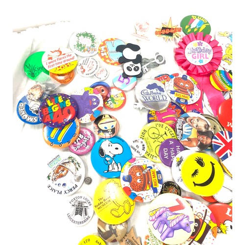 105 - Selection of various badges includes Butlins badge, Robertsons badges etc