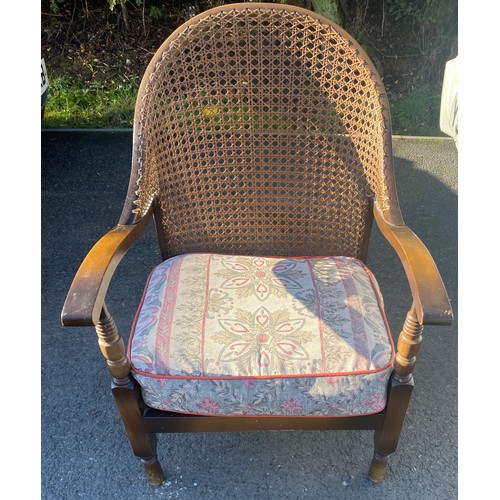 383 - Vintage bergere chair measures approx 33inches tall 22 inches wide and a Vintage footstool