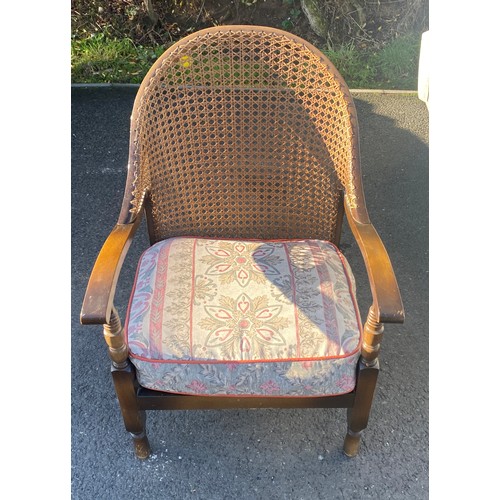 383 - Vintage bergere chair measures approx 33inches tall 22 inches wide and a Vintage footstool