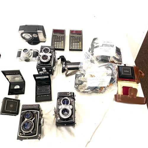 253 - Large selection of assorted camera equipment includes Yashica 24 body parts, Paxetts 35mm camera etc