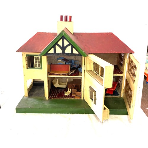 238 - Vintage dolls house and contents, house measures approximately  19 inches tall 22 wide 11 inches dep... 