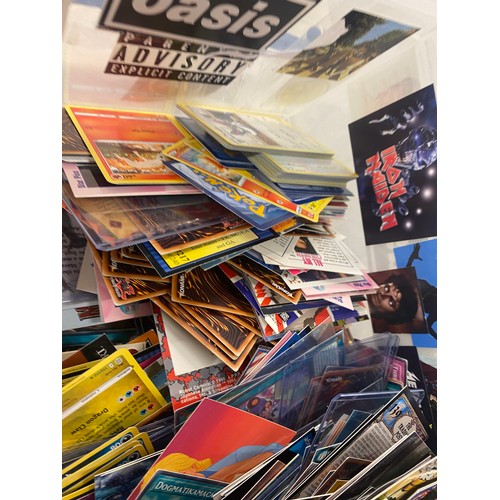 513 - A large selection of trading cards includes Pokemon, Yu Gi Oh, Baseball, Movies games and others