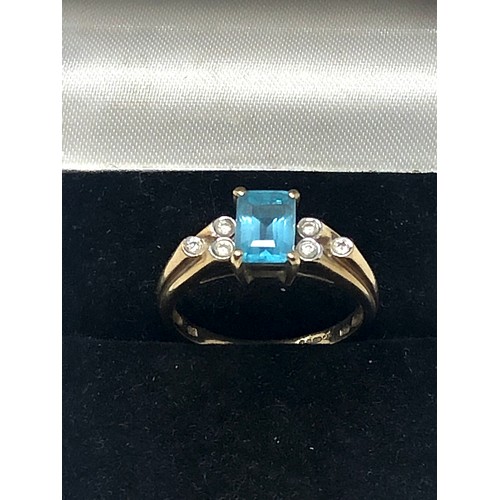 221 - 9ct gold topaz and diamond ring (2.6g)