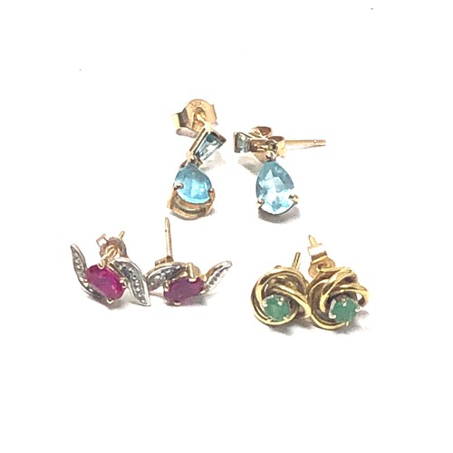 233 - 3 x 9ct gold paired gemstone stud earrings inc. topaz, emerald, synthethic ruby & diamond (3.8g)