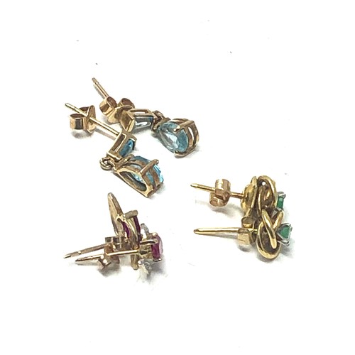 233 - 3 x 9ct gold paired gemstone stud earrings inc. topaz, emerald, synthethic ruby & diamond (3.8g)