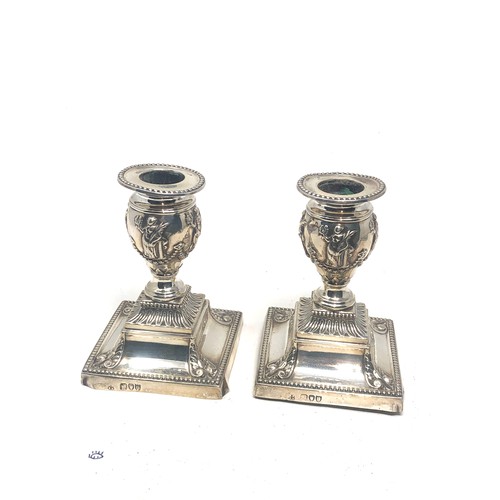 66 - Pair of antique silver candlesticks London silver hallmarks measure height 11.5cm filled bases