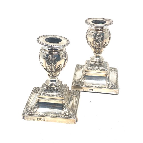 66 - Pair of antique silver candlesticks London silver hallmarks measure height 11.5cm filled bases