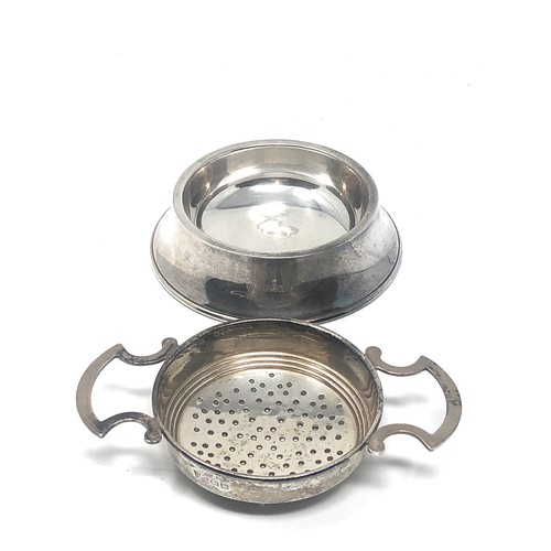 47 - Silver tea strainer Birmingham silver hallmarks measures approx 11.5cm wide 7cm dia