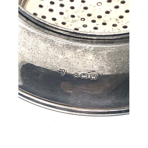 47 - Silver tea strainer Birmingham silver hallmarks measures approx 11.5cm wide 7cm dia