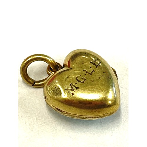 564 - Unmarked yellow metal, enamel and seed pearl locket, tests as 15ct gold, approximate weight 5.5g