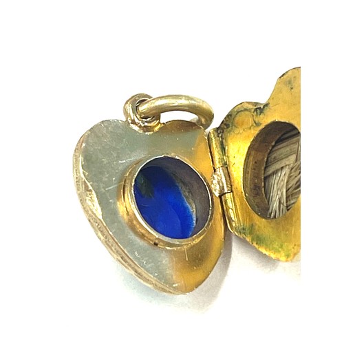 564 - Unmarked yellow metal, enamel and seed pearl locket, tests as 15ct gold, approximate weight 5.5g