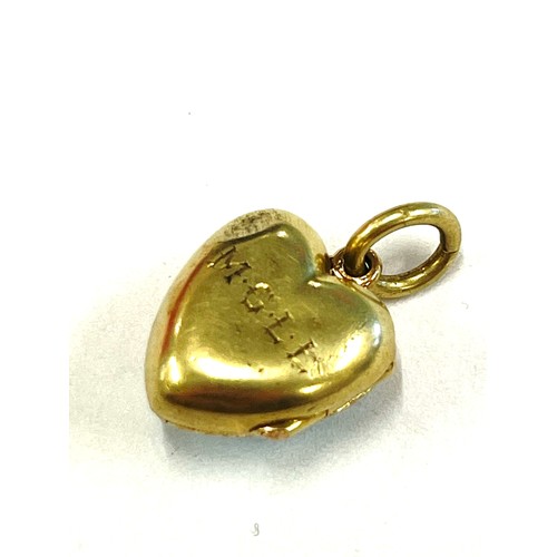 564 - Unmarked yellow metal, enamel and seed pearl locket, tests as 15ct gold, approximate weight 5.5g