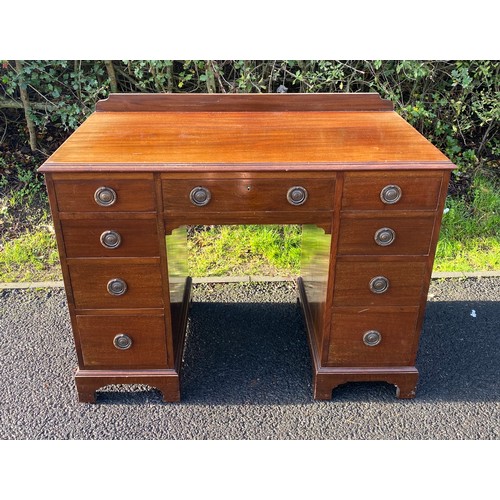 602 - Mahogany 9 drawer desk, approximate measurements 30.5 inches tall 40 inches wide 20.5 inches depth